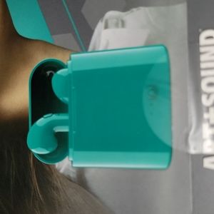 Teal wireless ear buds